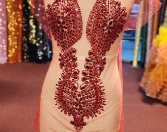Red rhinestone bodice applique.