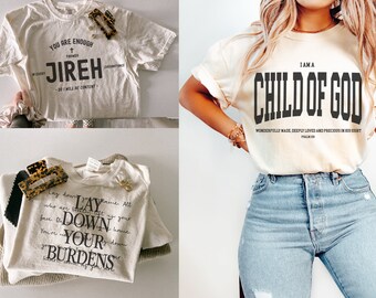 May include: Three different t-shirts with religious messages. The first shirt says "You are enough Jireh". The second shirt says "I am a Child of God Wonderfully made, deeply loved and precious in His sight Psalm 139:14". The third shirt says "Lay down your burdens".