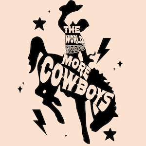 May include: Black graphic design on a light peach background. The design features a cowboy riding a bucking bronco with the text "THE WORLD NEEDS MORE COWBOYS". Stars and lightning bolts surround the central image.