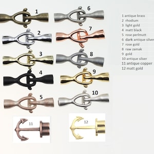 May include: Twelve different metal toggle clasps in various finishes, including antique brass, rhodium, light gold, matt black, rose perlmutt, dark antique silver, rose gold, raw zamak, gold, antique silver, antique copper, and matt gold. Two anchor-shaped clasps are also shown.