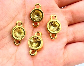 May include: Four gold-toned metal connector charms with a round, slightly domed center. Each charm has two loops for attaching to jewelry or other crafts.