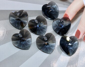 May include: Seven dark gray crystal heart-shaped charms with a hole at the top for hanging.