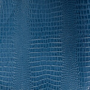 May include: A close-up of a blue textured fabric with a crocodile skin pattern.