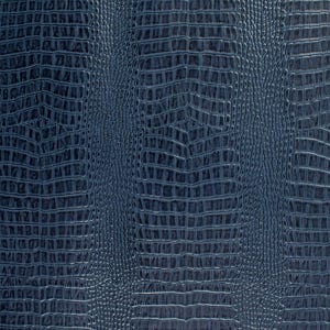 May include: Close-up of a dark blue textured fabric with a crocodile skin pattern.