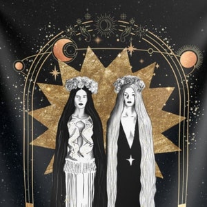 May include: A black tapestry with a gold design featuring two women in white and black robes standing in front of a large gold star. The women are wearing gold crowns and the background is a dark blue with gold stars.