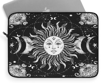 May include: Black laptop sleeve with a white sun and moon design. The sun has a face and the moon is in various phases. The background is black with white stars and constellations.