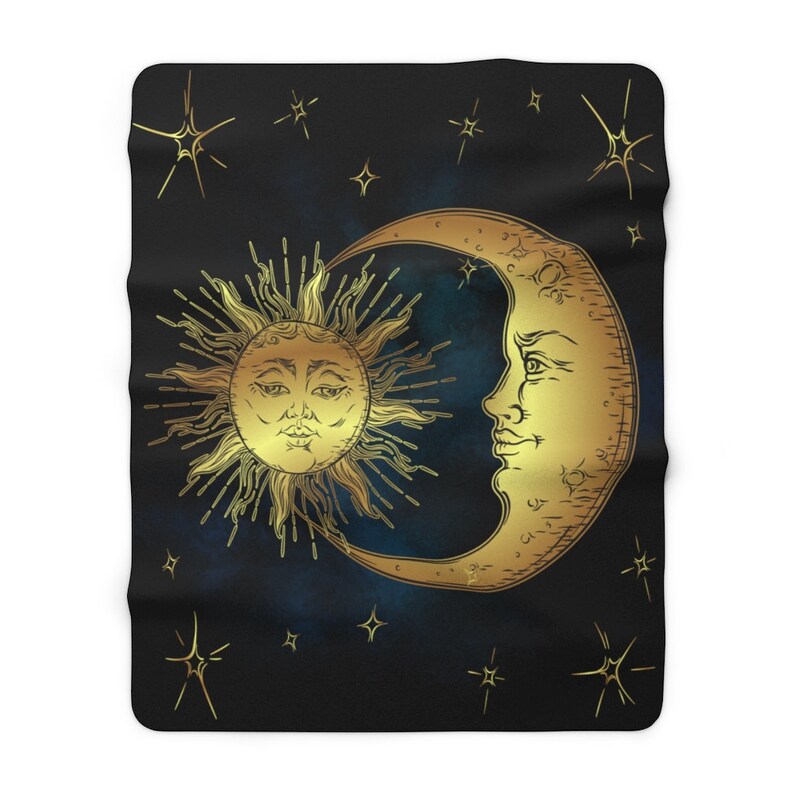 May include: A gold sun and crescent moon design on a black background with gold stars. The sun and moon have faces.