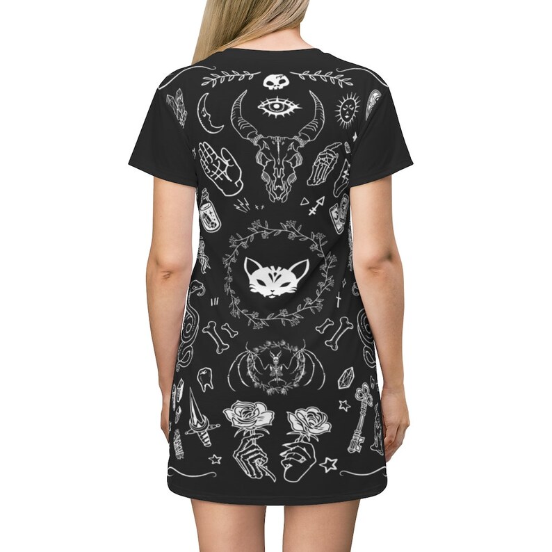 May include: Black t-shirt dress with a white print of various occult and mystical symbols, including a skull, an eye, a cat, roses, and bones.