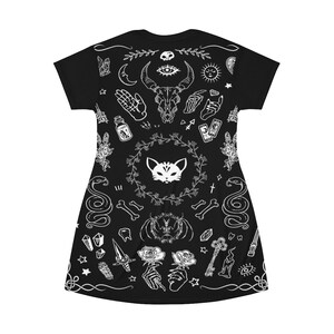 May include: Black t-shirt with a white print of various occult and mystical symbols, including a cat, snake, skull, and tarot cards.