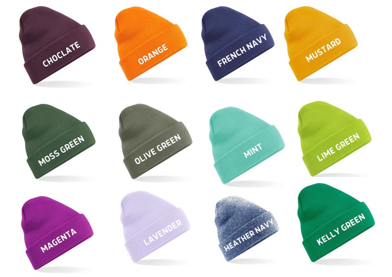 May include: A collection of colorful beanies in various shades, including chocolate, orange, French navy, and mustard. Each beanie displays its color name in white text. Other colors include moss green, olive green, mint, lime green, magenta, lavender, heather navy, and kelly green.