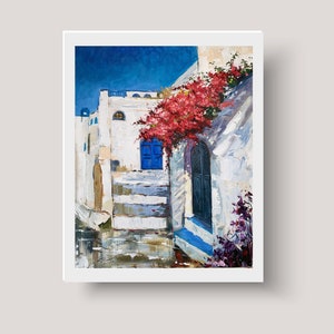 May include: A painting of a white building with a blue door and red flowers growing on the side. The building is in a narrow street with a blue sky in the background.