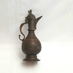 Antique Indian pitcher - a lovely example of a South Asian copper lidded water jug, with fine foliate detail, and pierced lid & brass handle