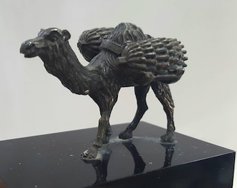 Vintage brass camel, a finely cast tarnished brass Arabian camel dromedary, mounted upon a rectangular black perspex plinth.