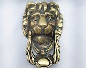 Antique brass lion head door knocker with integral strike plate and new bolts. Large Victorian lion door knocker. Period door furniture