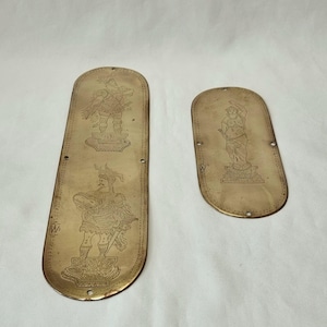 Two unusual 19th Century antique sheet brass finger plates with interesting engravings of historic figures in ancient attire.