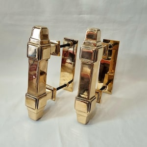 An exceptional pair of top quality early Art Deco bronze door pull handles including lovely backplate fittings, weighing over 4.75 kg.