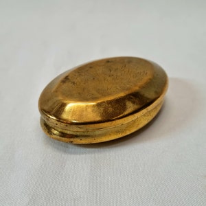 Brass snuff box - antique 19th Century Victorian plain chamfered oval engraved brass snuff box with tinned interior and lightly engraved lid
