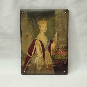 May include: Aged rectangular wall art depicting a crowned woman in royal dress, holding a scepter. The artwork shows signs of wear and tear, with a dark, vintage aesthetic. The color scheme includes red, gold, and green tones, typical of historical portraits.