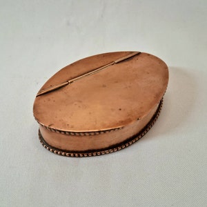 Copper snuff box - a mid 19th Century Victorian copper snuff box of oval form, with remnants of silver plated finish internally.