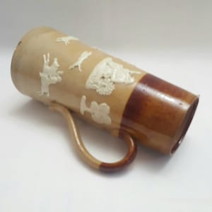 Doulton ale pitcher - a tall antique Doulton of Lambeth salt glazed stoneware ale water jug or pitcher, applied hunting scene decoration.