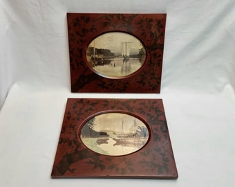 Mount Fuji prints - an unusual pair of Japanese photograph prints of Mount Fuji in lacquered frames painted in a foliate theme of leaves.