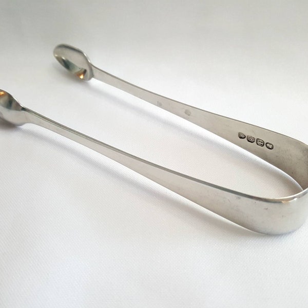 Silver sugar tongs - a George IV pair of hallmarked Sterling silver tongs by George Burrows II of London. Georgian dated 1821 weight 35g