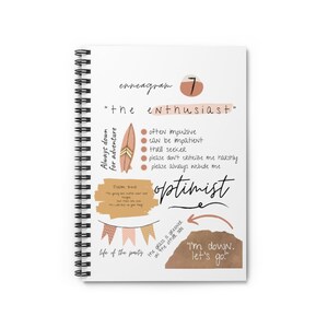 May include: A white notebook with a spiral binding features a pink and brown design with the text "enneagram 7" and "the enthusiast". The notebook also includes the text "Always down for adventure", "optimist", "life of the party", and "I'm down, let's go!"