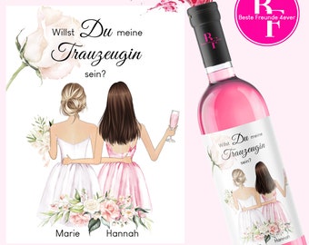 May include: A pink wine bottle with a white label that says "Willst Du meine Trauzeugin sein?" with two illustrated women in wedding attire. The text "Marie" and "Hannah" are below the women. The label also includes a floral design. The bottle has a pink cap and a pink liquid inside. The bottle is surrounded by a pink splash.