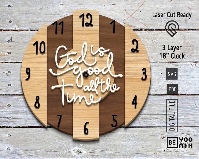 May include: A three-layer wooden clock with a brown and beige striped design. The clock face features the text "God is good all the time" in white lettering. The clock is 18 inches in diameter.