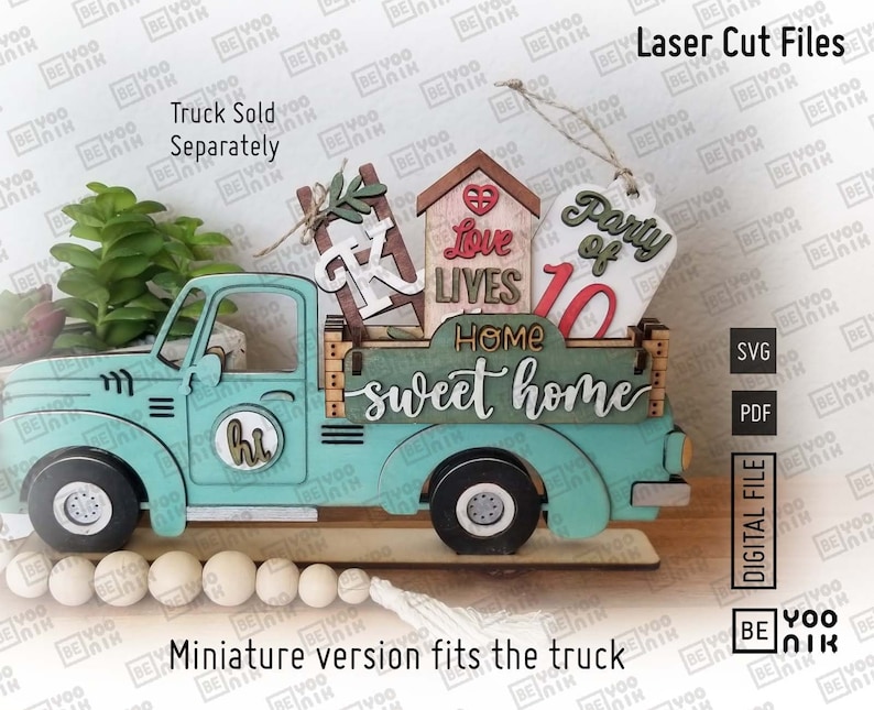 May include: A teal blue wooden truck with a white "hi" sign on the side. The truck bed is filled with wooden cutouts that say "Party of 10", "Love Lives", "Home Sweet Home", and a small house with a heart. The truck is sitting on a wooden base with a string of wooden beads.
