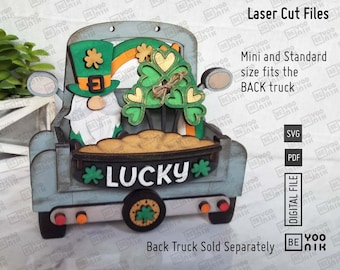 May include: A blue wooden truck with a green leprechaun gnome, shamrocks, and a pot of gold. The truck has the word "LUCKY" on the back. This is a laser cut file for a craft project.