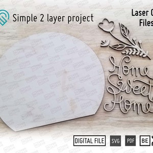 May include: Laser cut file design for a home sweet home sign with a floral element. The design is for a two-layer project.