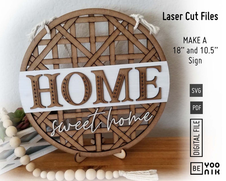 May include: A wooden round sign with a woven pattern and the words "HOME sweet home" in white lettering. The sign is 18 inches and 10.5 inches in diameter. The sign is a digital file for laser cutting.
