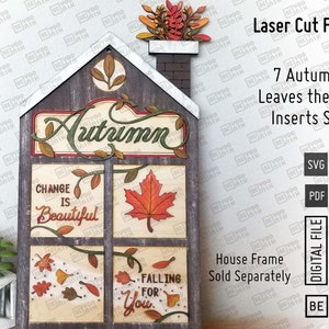 May include: Laser cut files for a house-shaped autumn themed craft project. The design features a house with windows and a chimney, with the words "Autumn", "Change is Beautiful", and "Falling for You" on the windows. The house is decorated with fall leaves and vines.