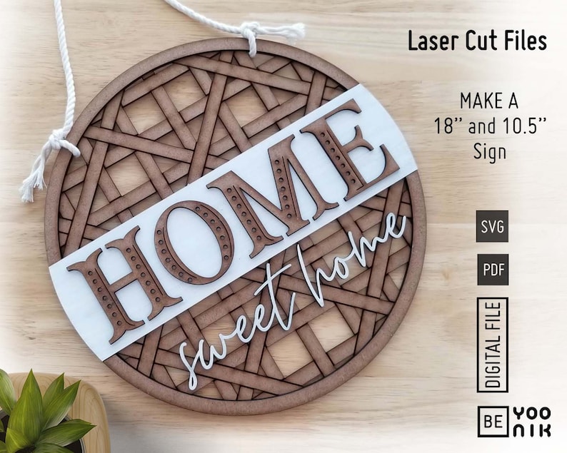 May include: A laser cut wooden sign with a white background and the words "HOME sweet home" in brown lettering. The sign is 18 inches and 10.5 inches and is available in SVG and PDF formats.
