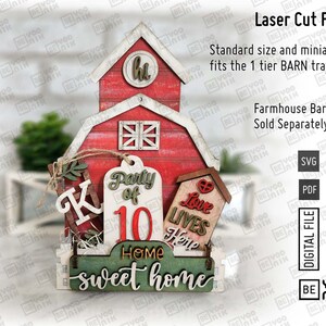 May include: Laser cut files for a red barn with a green sign that says "Home sweet home". The barn has a white window and a sign that says "Party of 10". There is a small red house with a heart and the words "Love Lives Here".