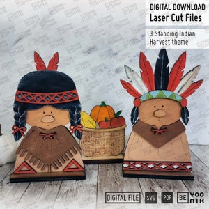 May include: Three wooden cutout figures of Native American people in traditional clothing. The figures are standing and holding a basket of fruit and vegetables. The figures are painted in red, brown, and white. The figures are part of a harvest theme.