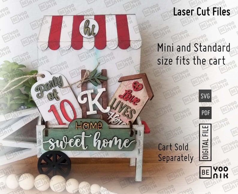 May include: A white wooden cart with red and white striped awning, decorated with various wooden signs. The signs say "Party of 10", "K", "Home Sweet Home", and "Love Lives Here".