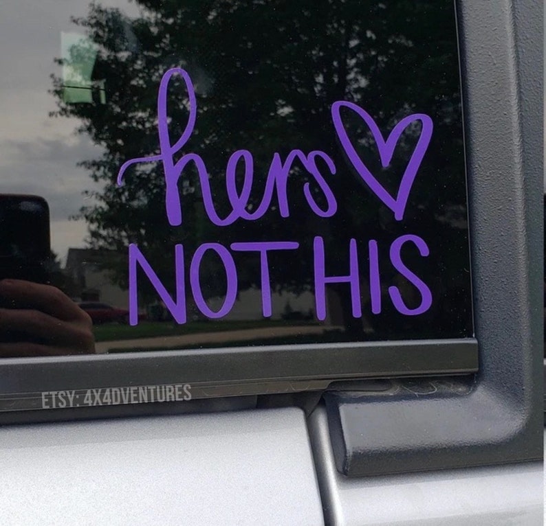 May include: Purple vinyl decal with the text "hers not his" and a heart symbol.