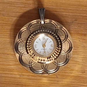 Vintage Caravelle Bulova Gold Tone Pendant Watch 1962-70s Ladies Necklace Watch Diamond Faceted Cut Medallion With Pedals Working