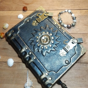 Aged black leather grimoire old golden book of shadows sun leather vintage journal genuine leather book handmade leather aged journal