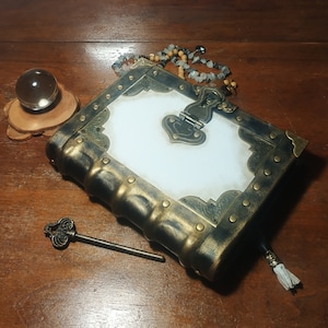 Aged white leather grimoire old book of shadows with aged paper black and white journal handmade genuine leather book mideaval grimoire