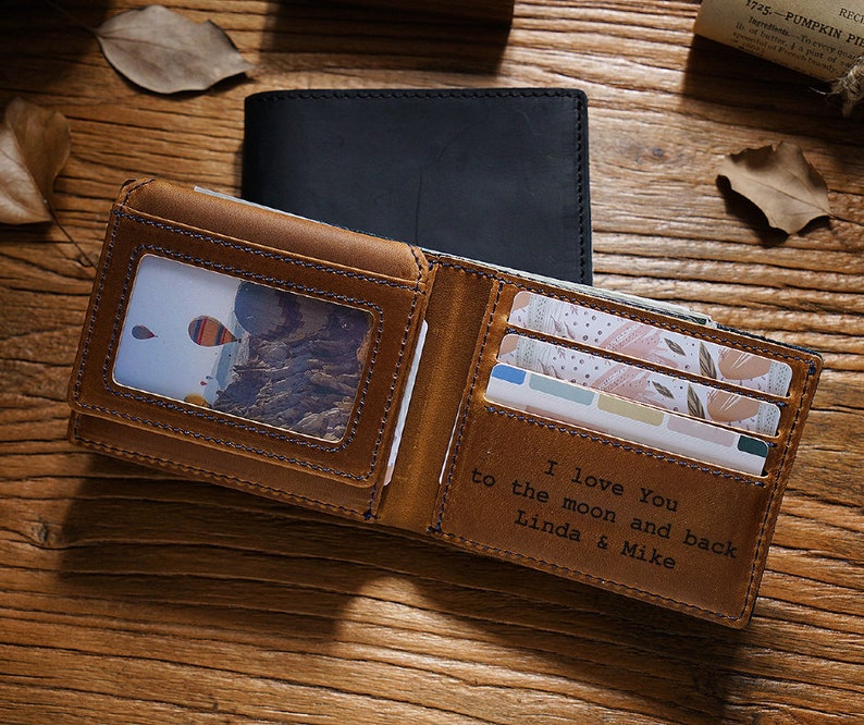 a wallet with a picture inside of it on a table