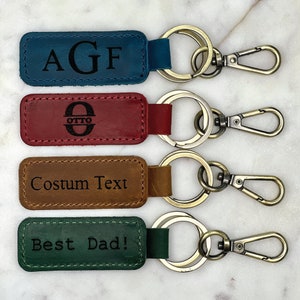 a set of four leather key fobrings