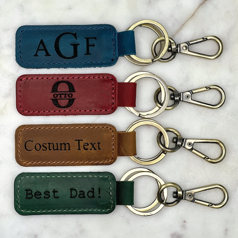 a set of four leather key fobrings