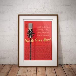 May include: A vintage-style poster with a red background and a microphone in the corner. The poster features the lyrics to the song "You Go to My Head" by Frank Sinatra. The text is in a bold, white font.