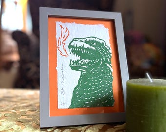 Godzilla - linocut print on handmade paper, 93mm x 145mm
