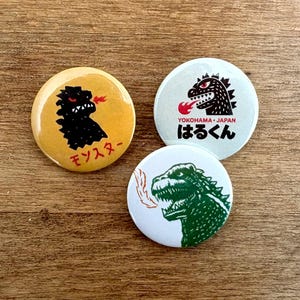 Set med 3 Godzilla-märken (32 mm)