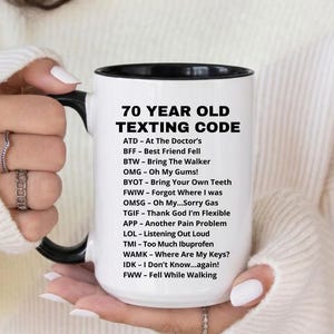 May include: A set of three ceramic mugs with a speckled, matte finish. The mugs are in shades of cream, light gray, and dark gray. Each mug has a simple, minimalist design, perfect for coffee or tea.