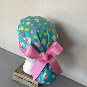 Avengers Ponytail Scrub Hat: Pediatric Nurse, Adjustable Buttons. Eggs on Blue